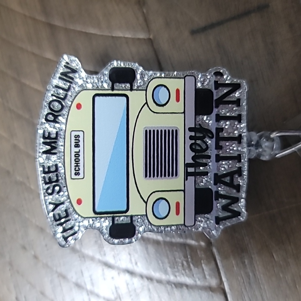 School bus badge reel